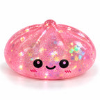 Squishyland jumbo glitter sugar dumpling squishy, 8.5cm maltose-inspired slow-rising sensory fidget toy with sparkly glitter finish.