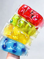 Set of four Squishyland fruit-shaped fidget stress balls featuring slow rebound, squeezable design for stress relief and sensory fun.