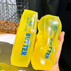 Squishyland Vaseline Butter Stick squishy toy, moldable and stress-relief fidget ball with a soft, buttery yellow appearance.